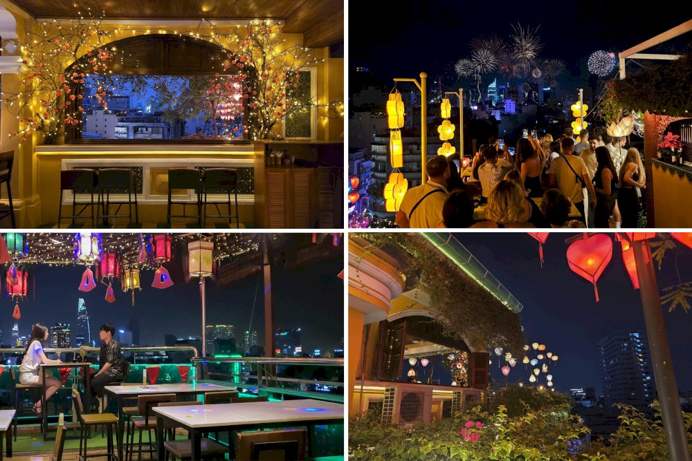 An open and spacious rooftop illuminated by Hoi An lanterns offering a view of city that feels both romantic and serene from above